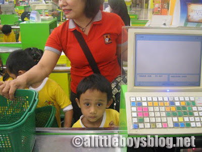 Kids go shopping Kids at the check-out counter