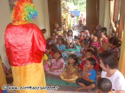 Kids entertained by a clown