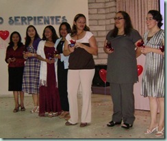 Women giving chocolates to husbands