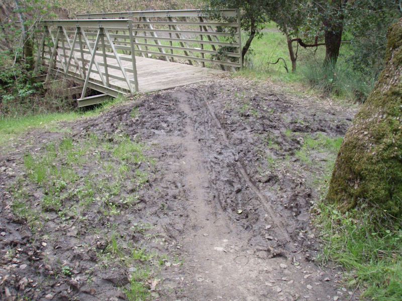 Shiloh bridge before The problem -- a mudhole where the trail approaches the bridge. Our plan -- put in a French drain and build the trail up with crushed rock.