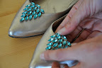 Adding the winning blue clips on to the shoes.