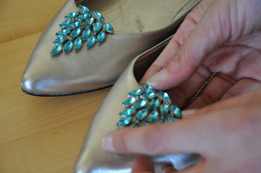 Adding the winning blue clips on to the shoes.