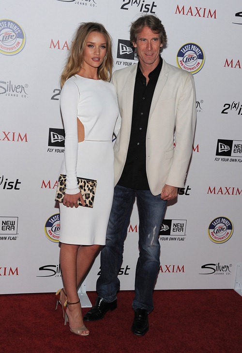 HOLLYWOOD, CA - MAY 11: Actress Rosie Huntington-Whiteley (L) and director Michael Bay arrives at the 2011 Maxim Hot 100 Party with New Era, Miller Lite, 2(x)ist and Silver Jeans Co. held at Eden on May 11, 2011 in Hollywood, California. (Photo by Angela Weiss/Getty Images For MAXIM) *** Local Caption *** Rosie Huntington-Whiteley; Michael Bay