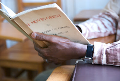 Student studying a book in French