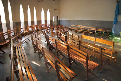 Empty church with pews and windows