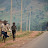 Children running along road