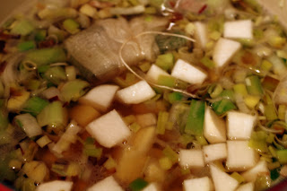 picture of stock, bouquet garni, potatoes, turnips, and salt being added to pot