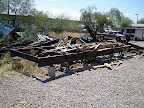 This was the beginning of the trailer. It was a 60 or 70' long frame for a mobile home that was taken off the frame and then cut into three sections. We bought the frame for scrap and paid $50.
