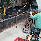 Hugh, a master welder and Hot Rod builder, is welding the two "I" beams together and welding a gusset plate for additional strength.