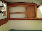 A magazine rack and bookcase in the master berth- nice touch.