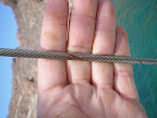 The rigging has some light rust signs. This indicates the rigging may need to be replaced in a soon as a season or two. As soon as the strands start breaking individually- it's time to replace the rigging.