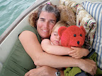 Hil and Emma napping with red bear in the cockpit.