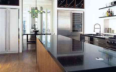 John Minshaw interior pattern In the kitchen a walnut island section is surfaced with absoluto granite