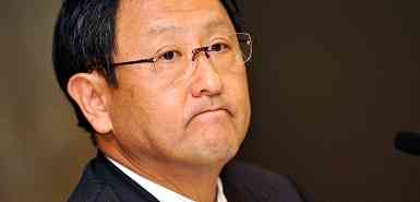Akio Toyoda, boss of Toyota Motor Corporation, reacts as he listens to questions from reporters