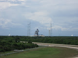 One of two launchpads for the shuttle.  The three tallest structures are lighting towers.  Beside the one on the right is a water tower.  Water underneath the shuttle during launch dampens sound and heat from the exhaust gases.  The two white pods on either side contain liquid hydrogen and liquid oxygen.