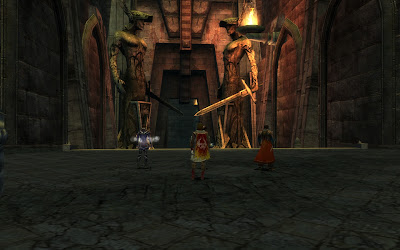 Two collosal statues guard an entrance.