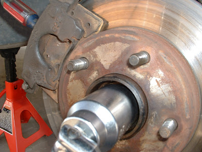Then get a big ass socket (36mm in this case) and loosen the axle nut.  This was the PITA part because the passenger side was really on tight.  Ended up having to take it to a shop and they broke it loose for free.  If you ever have to do this.  Good luck!