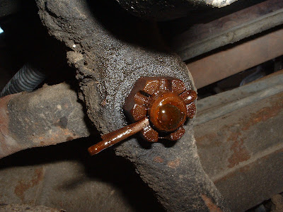 Once the bracket is off the frame, I took the cotter pin out of the nut that holds the idler arm to the center link.  Work it PB Blaster!