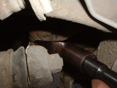 But oh, thats not it.  Now you have to hammer the idler arm apart from the center link.  This part took me forever, mostly becase I dont have a BFH (Big Fn Hammer).  So after an hour of hammering and coming at it from different angles, I finally got it off.