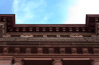 Compressed Height: This was taken looking up to the tops of an ornate building. I found the detailing particularly striking. (1/500 sec @ f/1.8; 50mm) Copyright 2009, Kerri Shotts