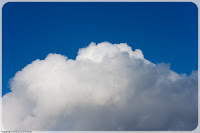Puffy White Stuff: This was taken between showers, with the sun about an hour or two ahead of sunset. The light and the sky were just perfect, and there sat this wonderful little white puffy cloud! (1/250 sec @ f/8; 50mm)