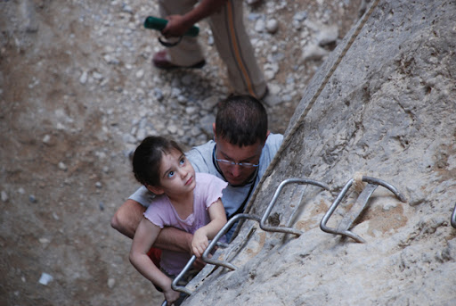 Noam, four years old climbing up the vertical cliff nahal og