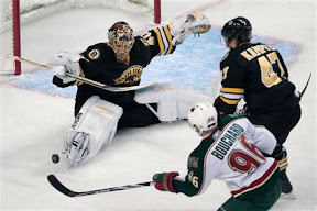 Tuukka Rask makes a save