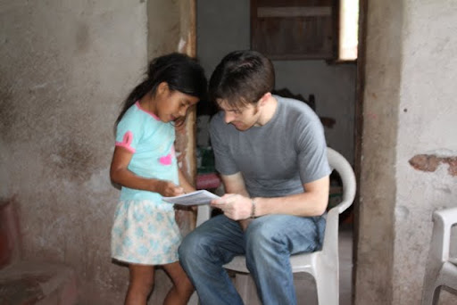 Showing school work enhanced by solar lamp usage