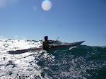 Doug Van Doren about to push the bow of his Valkyrie over the top of a swell on a blustery day on Lake Michigan. http://keithwikle.com