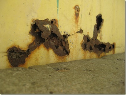 rust on the bottom of a door