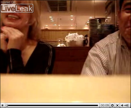 Screen capture of LiveLeak video of a sushi converyor belt video