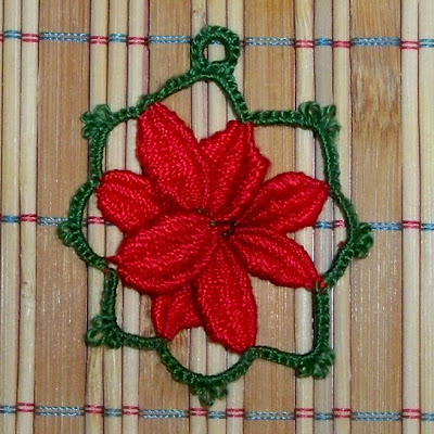 Flor cluny de pétalos rojos y borde verde