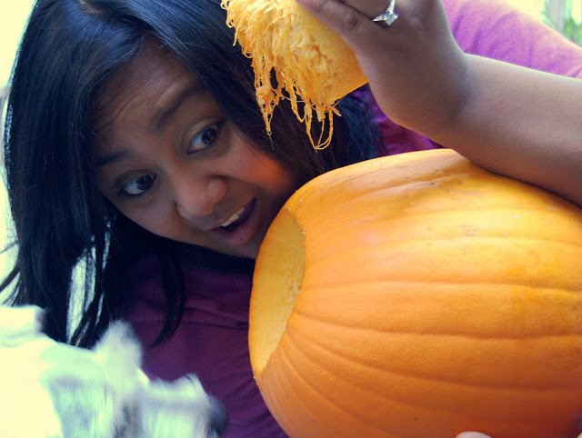 Maui and I are gutting out our pumpkin!