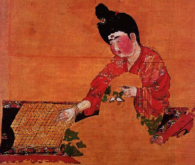 Chinese woman stitching embroidery and playing Go.