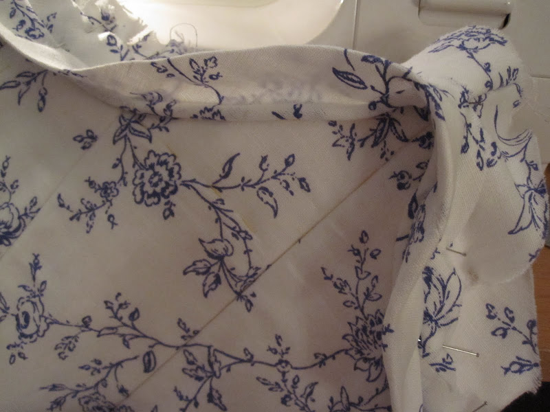 Centre back point. Bias pinned in place ready to be sewn. Centre back point. Bias pinned in place ready to be sewn.