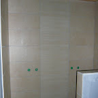 Luksus dobbeltbadet med mosaik fliser i midten.