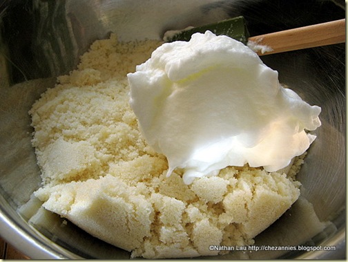 Folding egg whites into almond paste and sugar