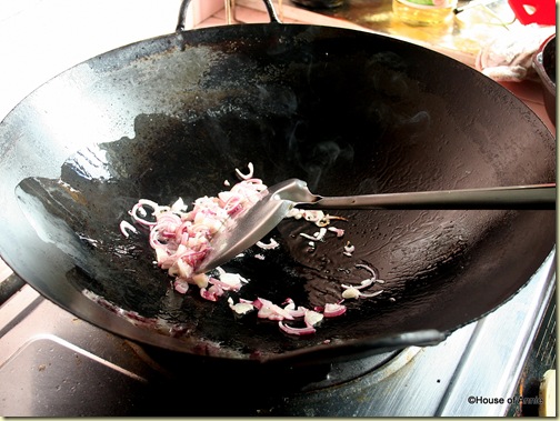 Frying shallots in wok