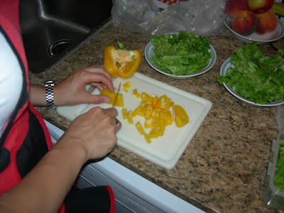 Kate chopping a yellow pepper