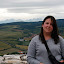 Andi with the Vysoke Tatry (High Tatra) Mountains in the background. Picture taken on top of the tallest tower of the Spisky Hrad Castle.