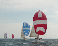 Zukasky Regatta 2009 / Final leg of the second race:  Collaboration (red & white) leading, then Tsunami (blue & white), then Cancan (purple and white) and Mojo (red).