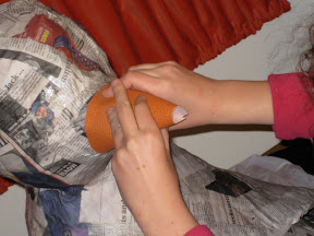 We quickly discovered that it wasn't, even with the help of spray adhesive.  No, it was much harder.