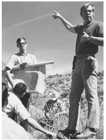 Clark Burchfiel leads a field trip to the Clark Mountains, Basin and Range Province, in California with Greg Davis (background) in 1971 