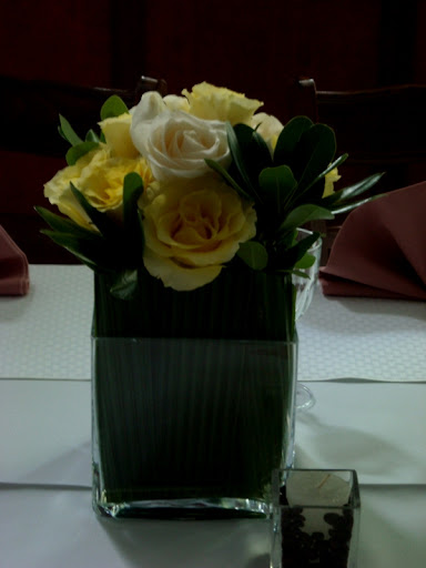 Square vase wedding centerpiece with yellow roses When you are considering