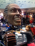 Christine folding clothes with Iverson's huge bobblehead