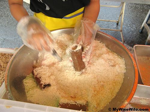 Filling the stuff into bamboo tube