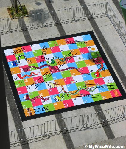 Giant Snake and Ladder Game at urban square Giant Snake and Ladder Game at urban square