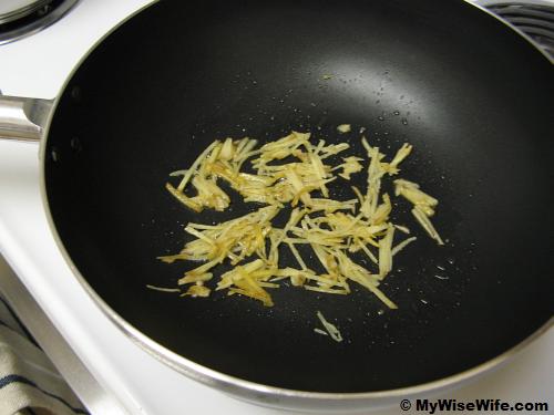 Heated sesame oil is added with ginger Heated sesame oil is added with ginger
