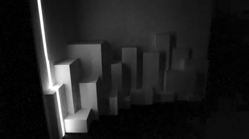 Gif Animado de um Feixe de Luz Passando por Uns Solidos