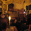 In the smoking room with some people.